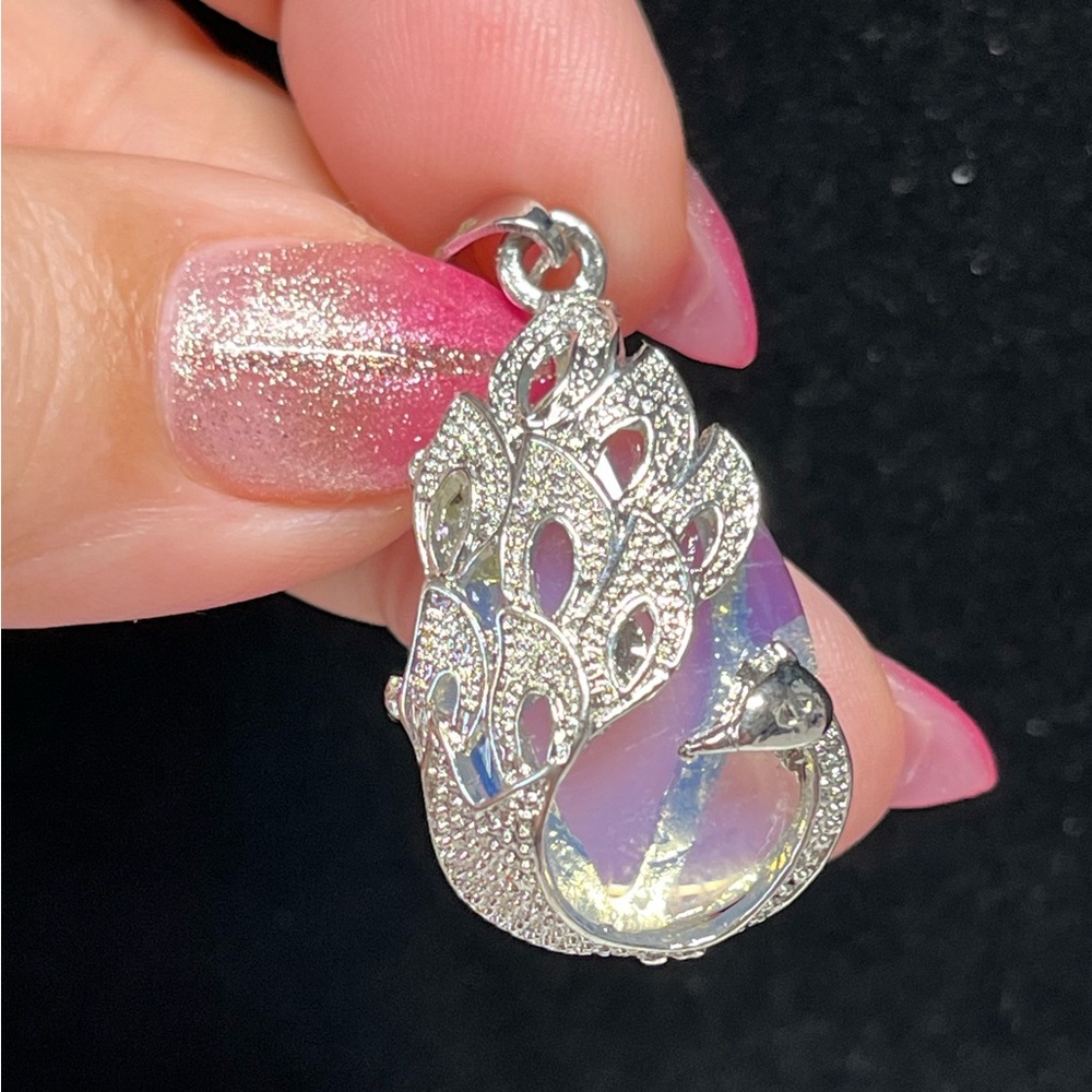 Shiny Silver pendant with created opalite and peacock features